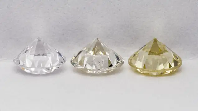 Suite of three diamond master stones; "E", "K-L" and "Z" in grading position: table down, pavilion view.